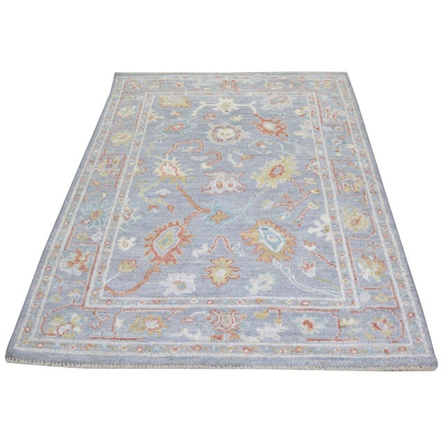 Hand-knotted with care using traditional rug-making techniques, this wool rug blends timeless craftsmanship with a modern...