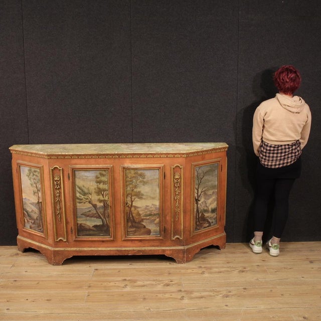Venetian sideboard from the mid-20th century. High quality furniture in carved, lacquered and hand painted wood with...