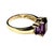 14K Yellow Gold and Amethyst Cocktail Ring. Ring features richly colored emerald-cut amethysts in a three-stone...