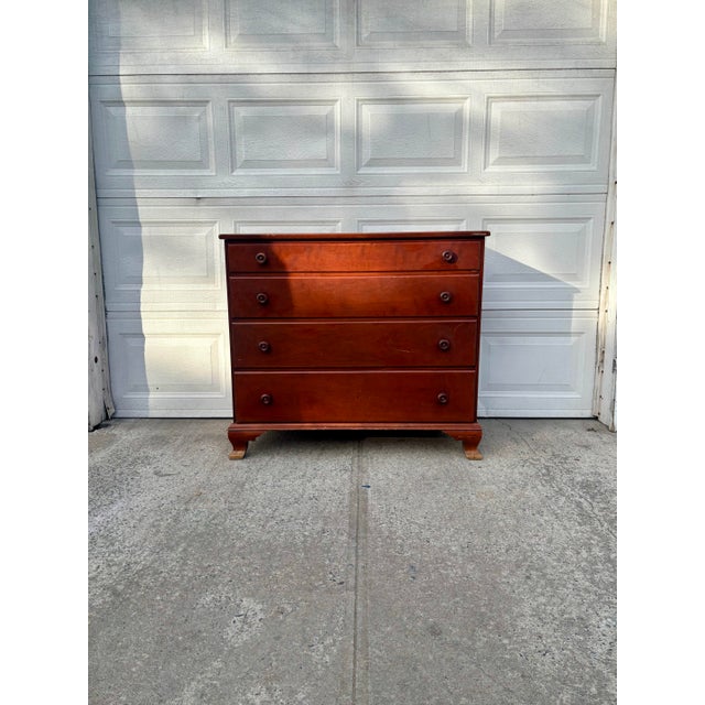 We have a beautiful solid wood Early American dresser for sale. This vintage 4 drawer chest features a warm maple tone,...