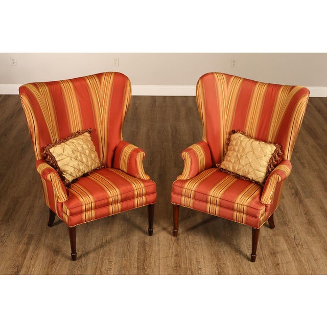 High Quality American Made Pair Of Custom Upholstered Fan Back Winged Chairs Featuring Striped Fabric In Warm Tones With...