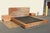 Wonderful vintage rustic modern bedroom set featuring a King size platform bed frame with matching headboard and pair of...