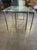 This set of vintage French brass nesting tables with glass tops is perfect for adding a touch of elegance to your home....