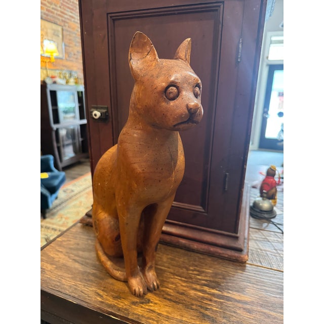 Gorgeous wooden seated cat sculpture attributed to Sarreid, Italy. Midcentury. Life-sized. Warm colored wood (oak? Pecan?)...