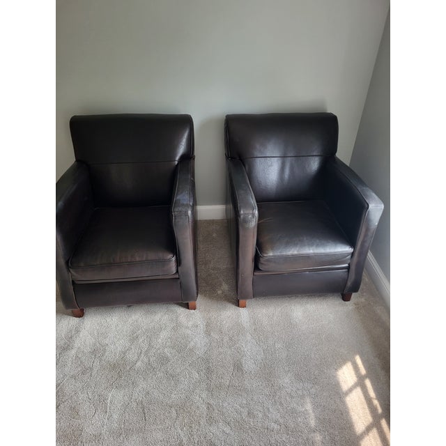 Pair of dark brown leather club Bradington-Young chairs. This set includes two leather chairs. Leather has some wear. I...