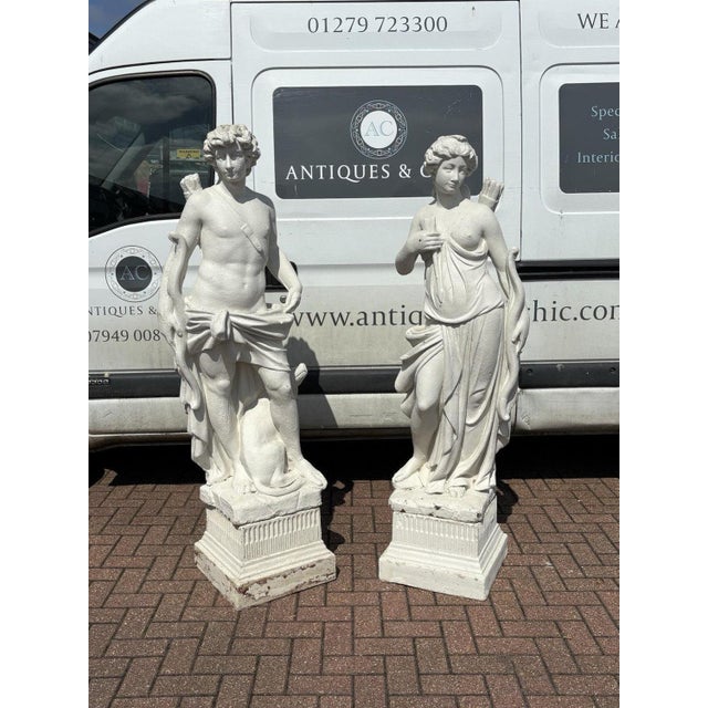 Pair Of Classical Diana & The Hunter Garden Statues On Based. Large In Size . Sizes :- Hunter : 172 cms total height Diana...