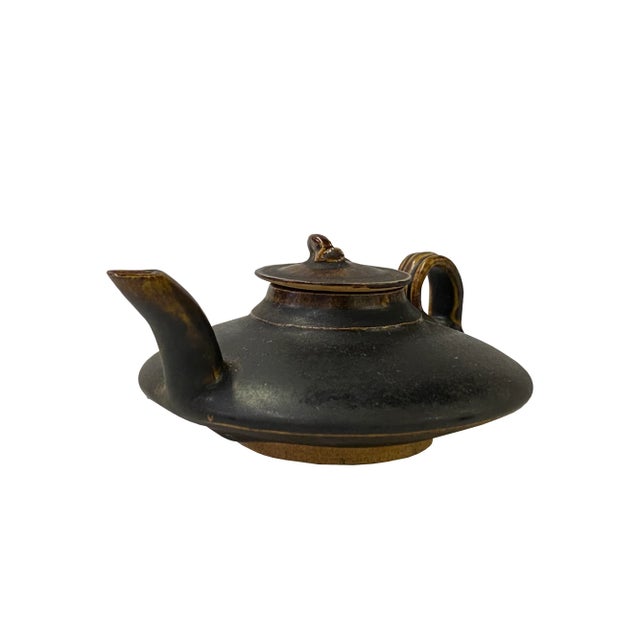 This is a handmade Chinese accent decorative art teapot made of ceramic in brown black mix color with brown tan rim. ( Not...