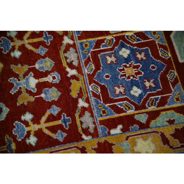 This modern finewoven Turkish Oushak rug is a stunning piece of art that has been handwoven using traditional techniques...