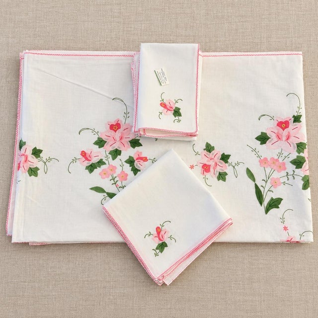 Beautiful vintage mid-century cotton tablecloth with 11 coordinating napkins, featuring delicate hand-appliquéd pink...