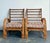 This striking pair of vintage rattan lounge chairs exemplifies the relaxed sophistication of mid-century tropical design,...