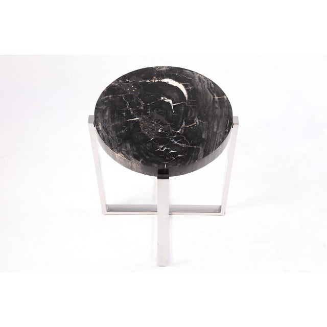 The top of this modern accent side table is made of one slice of organic petrified wood, hand polished to show its...