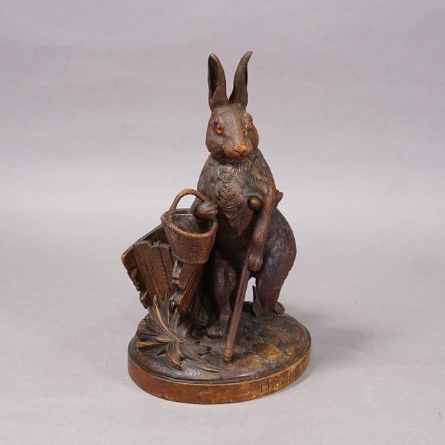 Antique Black Forest Carved Rabbit Figure with Basket, circa 1900 Item e8146 A finely carved wooden figurine from the...