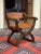 Antique Dagobert armchair made of solid oak with leather seat and backrest. The design is based on a historical medieval...