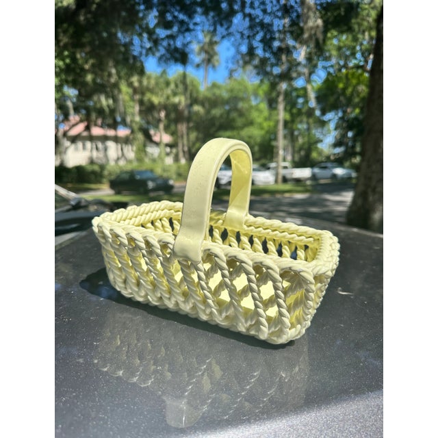 Mid-century Italian trompe l'oeil ceramic rope basket. Light greenish yellow. Ideal to use to store fruit or on a...