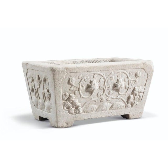 This solid marble floral planter is a beautifully crafted piece, featuring intricate floral carvings that bring an elegant...