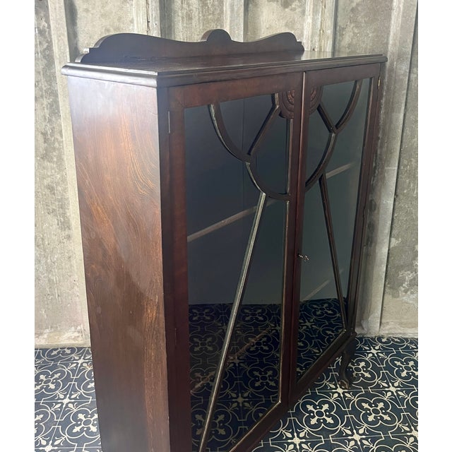 This antique Art Deco furniture piece is a mahogany glazed display cocktail cabinet or bookcase, known for its rich colour...