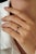 This band ring features a 0.15 carat baguette-cut blue sapphire, set in 14K white gold. The sapphire measuring...