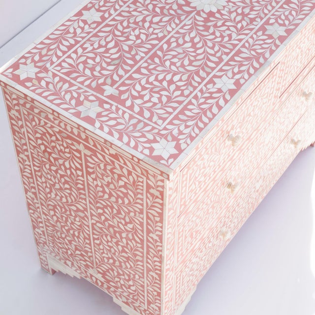 The Arabesque Bone Inlay Four Drawer Chest explores the decorative richness of traditional floral ornamentation through a...