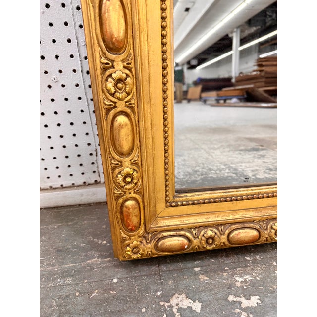This 19th Century French mirror is top of its class! With its stunning gilded adornments such as its hand carved edging,...
