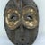 One notable feature of the Bembe Helmet Mask that offers insight into its age and method of creation is the presence of...
