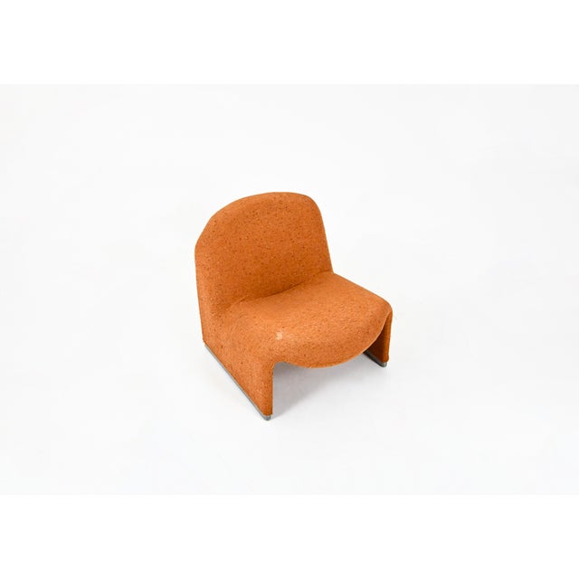 Alky armchair in original orange fabric. Seat height: 38cm. Castelli labels. Wear due to time and age. This piece has an...