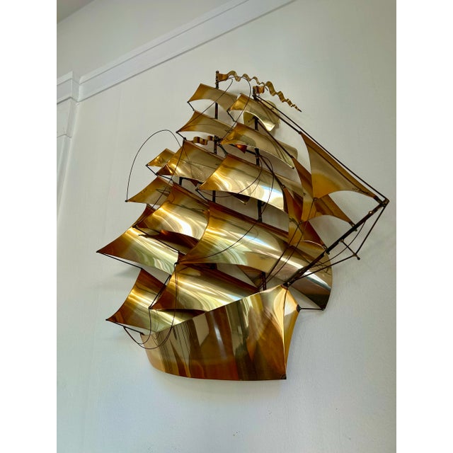 This vintage 70's John Demott tall sailing ship is handcrafted from brass and ready to hang. A stunning modernist addition...