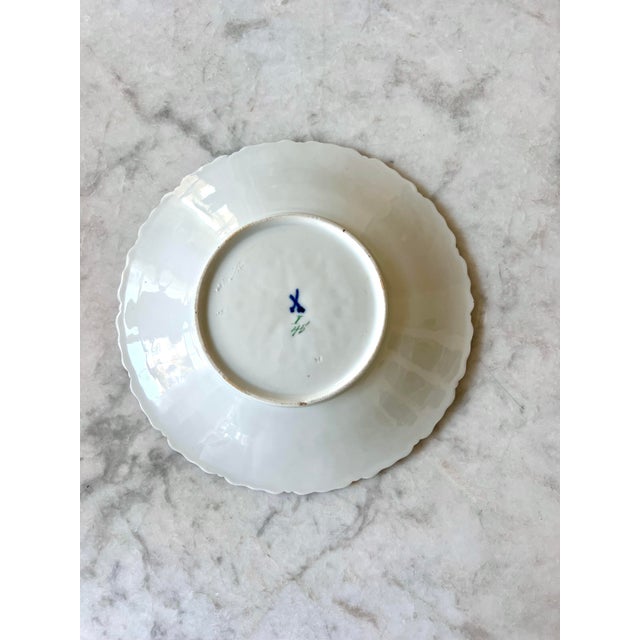 Exquisite antique Meissen porcelain plate featuring finely modeled raised white floral scrollwork, hand-applied gilt...