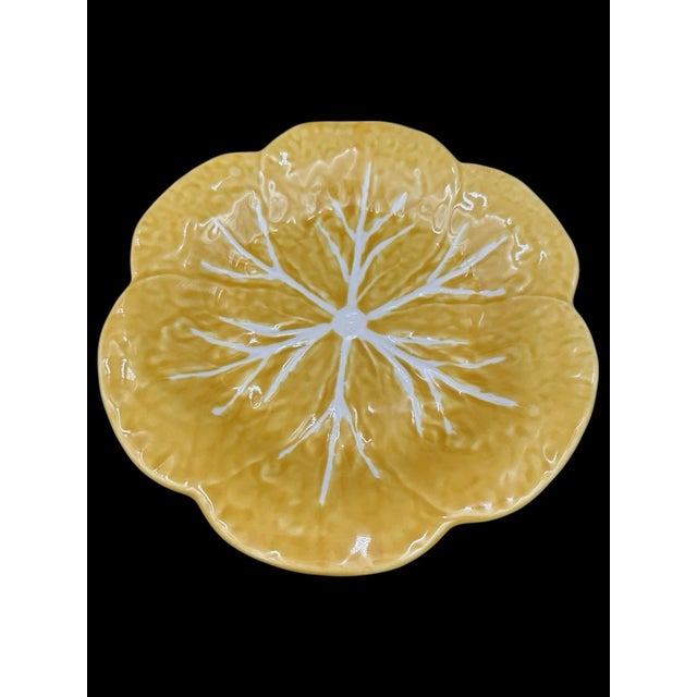 Beautiful Bordallo Pinheiro luncheon plate featuring the iconic cabbage leaf design in a vibrant yellow glaze. Known for...