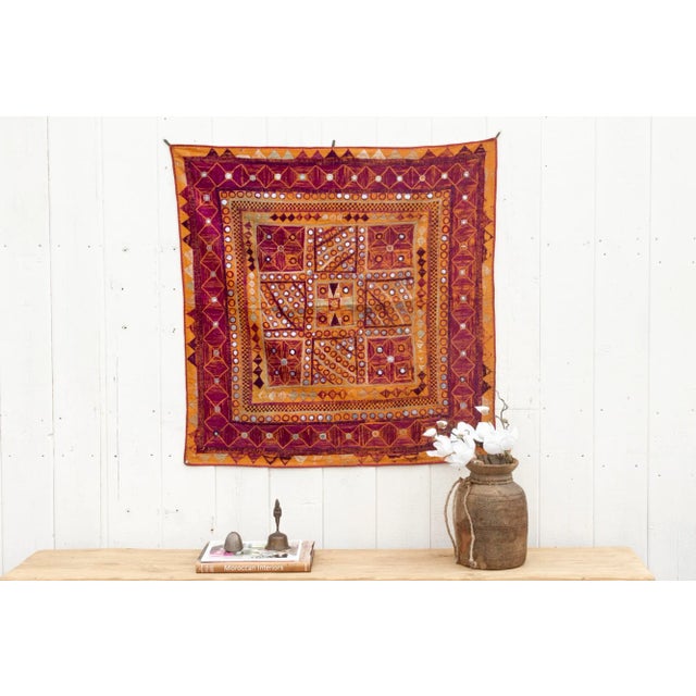 This finely embroidered antique textile panel is a testament to the artistry of the Kutch region in Gujarat, India, hails...