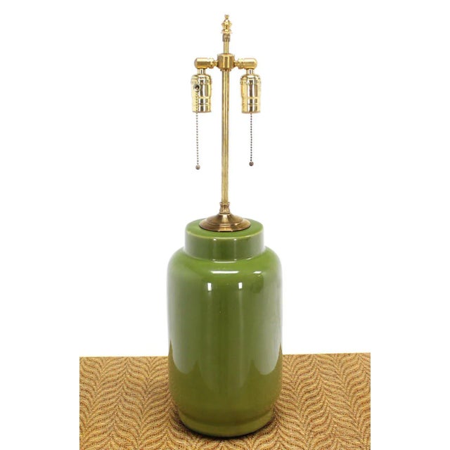 Soft green color ceramic glaze cylinder base table lamp. Perfect for a mid century style home.