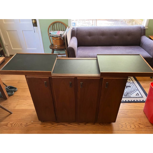 This is an authentic 1960s Founders Furniture rolling bar cart, marked with the "FOUNDERS" maker's stamp inside the...