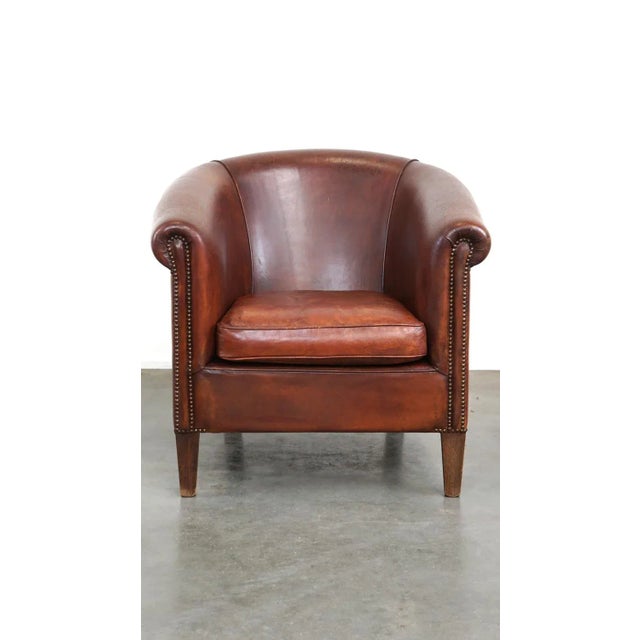 This lovely sheepskin leather club chair can be easily placed in both modern and classic interiors. Due to responsible...
