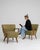 A refined pair of Danish mid-century modern armchairs, reflecting the clean lines and ergonomic design principles of...