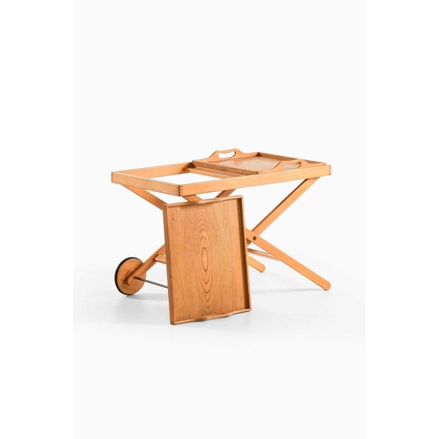 This rare trolley or tray table was designed in collaboration by tapio wirkkala and aulis leinonen and produced by asko in...