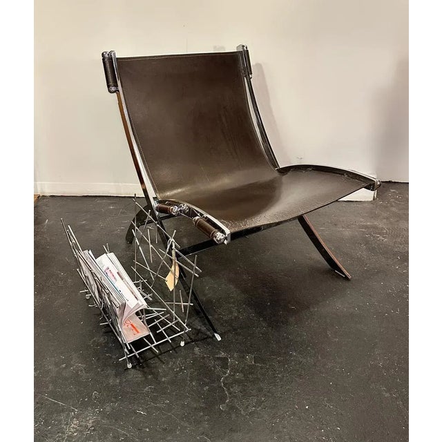 A stunningly rare leather & chrome scissor lounge chair, by Paul Tuttle and Antonio Citterio for Flexform Italy designed...