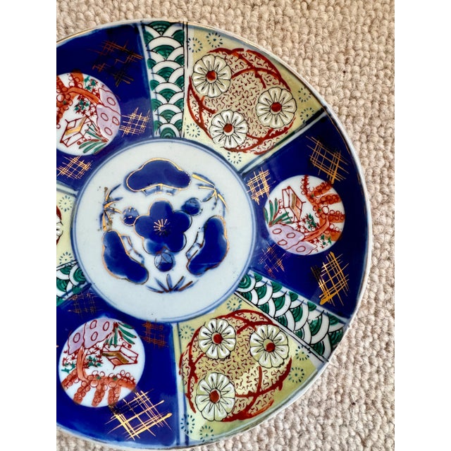 Beautiful vintage Imari plate in blue, green, orange and gold. Excellent condition with no chips or cracks. 9.5" diameter.