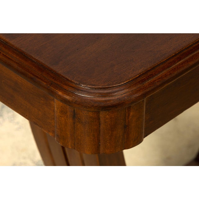 1930s French Art Deco walnut console table, sourced in Provence, France. The console features a long rectangular top with...