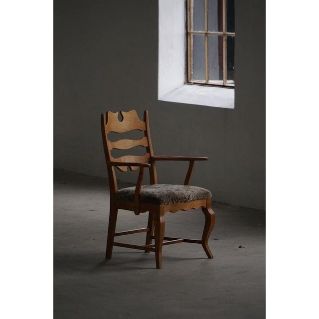 A stunning brutalist oak armchair designed by henning (henry) kjærnulf for e.g. Møbler produced circa the 1960s, this...