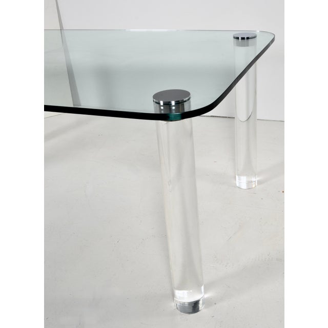 Very fine Pace Collection dining table featuring a 3/4" glass table top with four polished lucite legs, and Pace signature...
