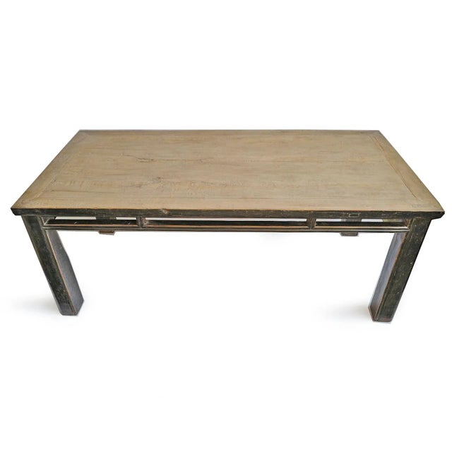 Vintage salvaged elm wood distressed black frame dining table with natural tan top. Traditional Ming style with beautiful...