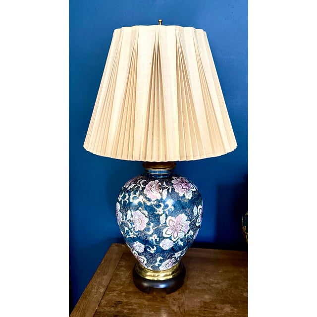 Elegant Frederick Cooper dark blue floral table lamp featuring its original harp, finial and vintage Stiffel knife pleated...