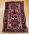 "This vintage Persian Heriz Karajeh area rug, hand-knotted in the second quarter of the 20th century, features the iconic...