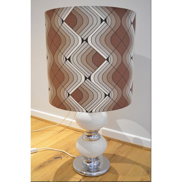 Beautiful table/floor lamp from the 1960s/70s by Sölken Leuchten. The lamp has an illuminated chrome base with two white...