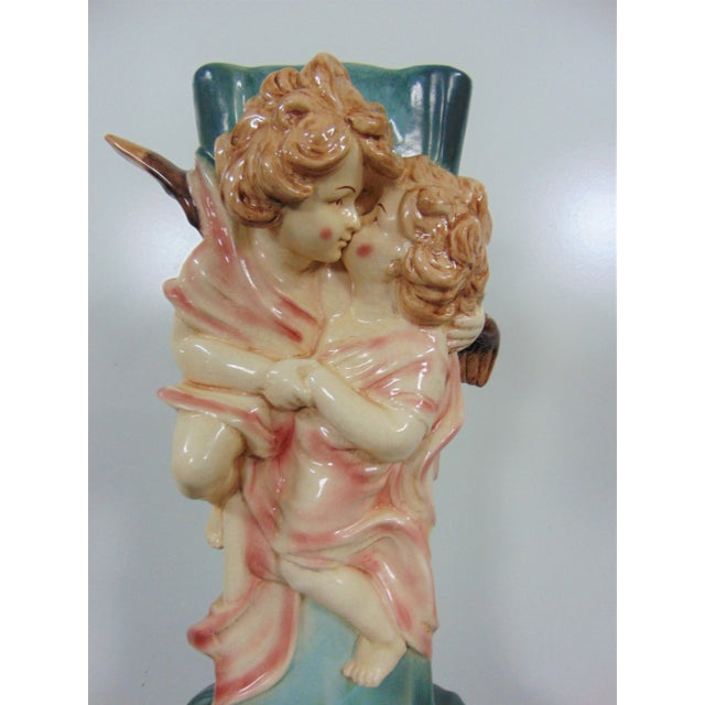 Art Nouveau umbrella stand by Charenton Pottery , 2 figural cherubs embracing