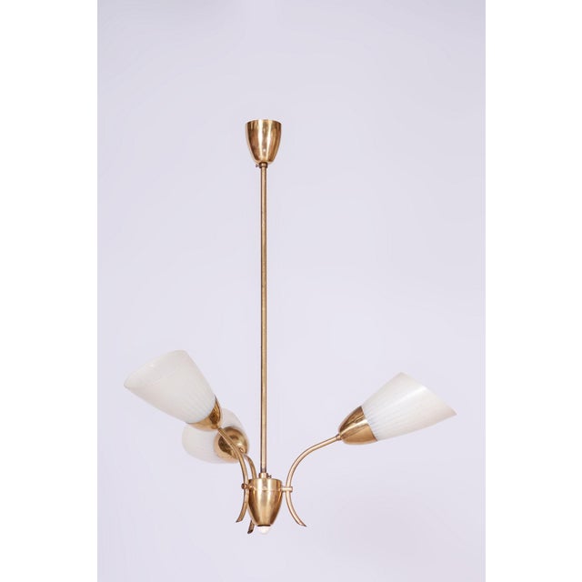 This exceptional pendant chandelier dating back to the 1950s embodies the charm and craftsmanship of Czechoslovak lighting...