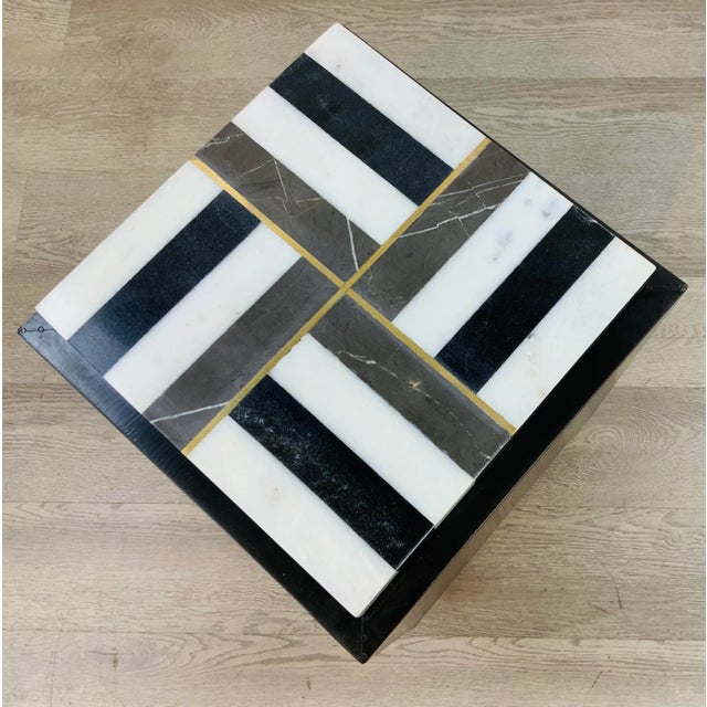 Stylish Currey & Co. Black and White Marble Side Table, black metal foil base, brass accents, showroom floor sample