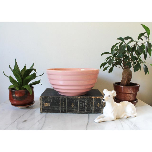Vintage pink pottery Ringware beehive mixing bowl. No makers mark. Some factory flaws.