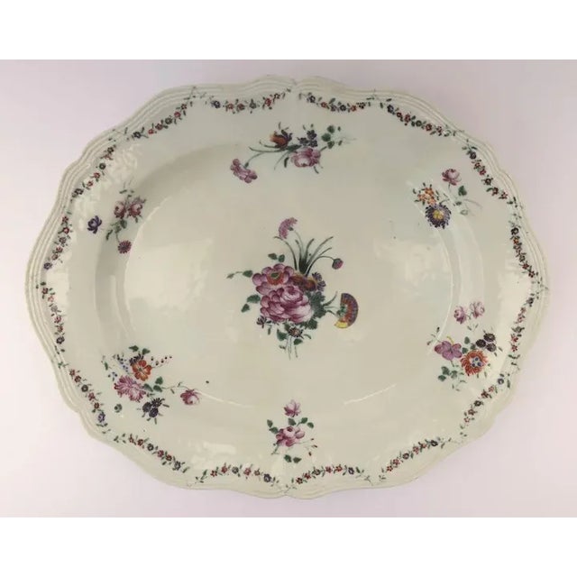 Early 19th century Chinese export platter with beautiful floral sprays shaped edge. 13 1/2" x 11" C.1800 Note: The platter...