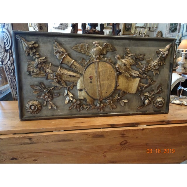 Exquisite French Louis XVI architectural panel with detailed gilt wood carving on a green painted background. Quiver and...