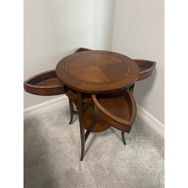 Italian cherrywood side table by Assi d’Asolo, featuring a decorative parquetry-style top and four concealed petal-shaped...